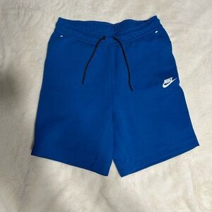 Blue Nike Tech shorts